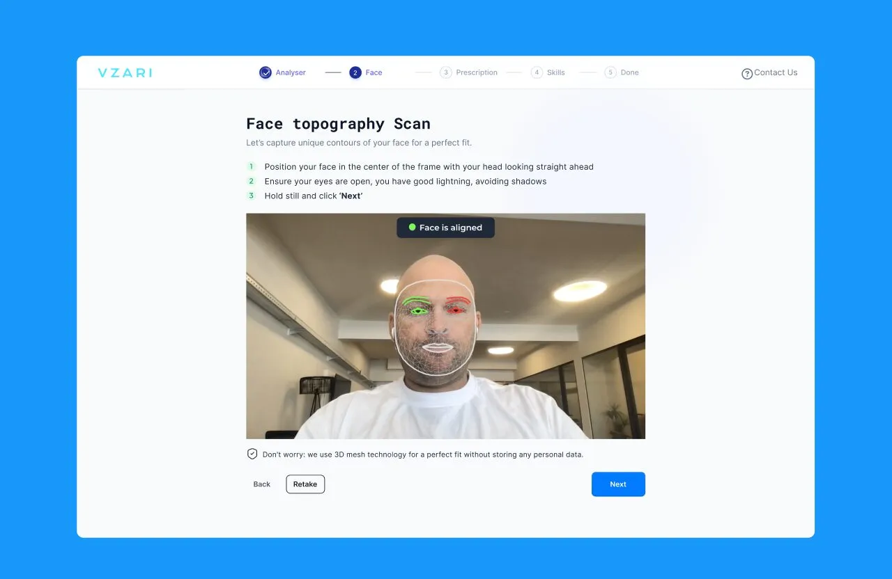 Vzari face topography scan step showing a webcam view of a face with a mesh overlay and instructions to hold still