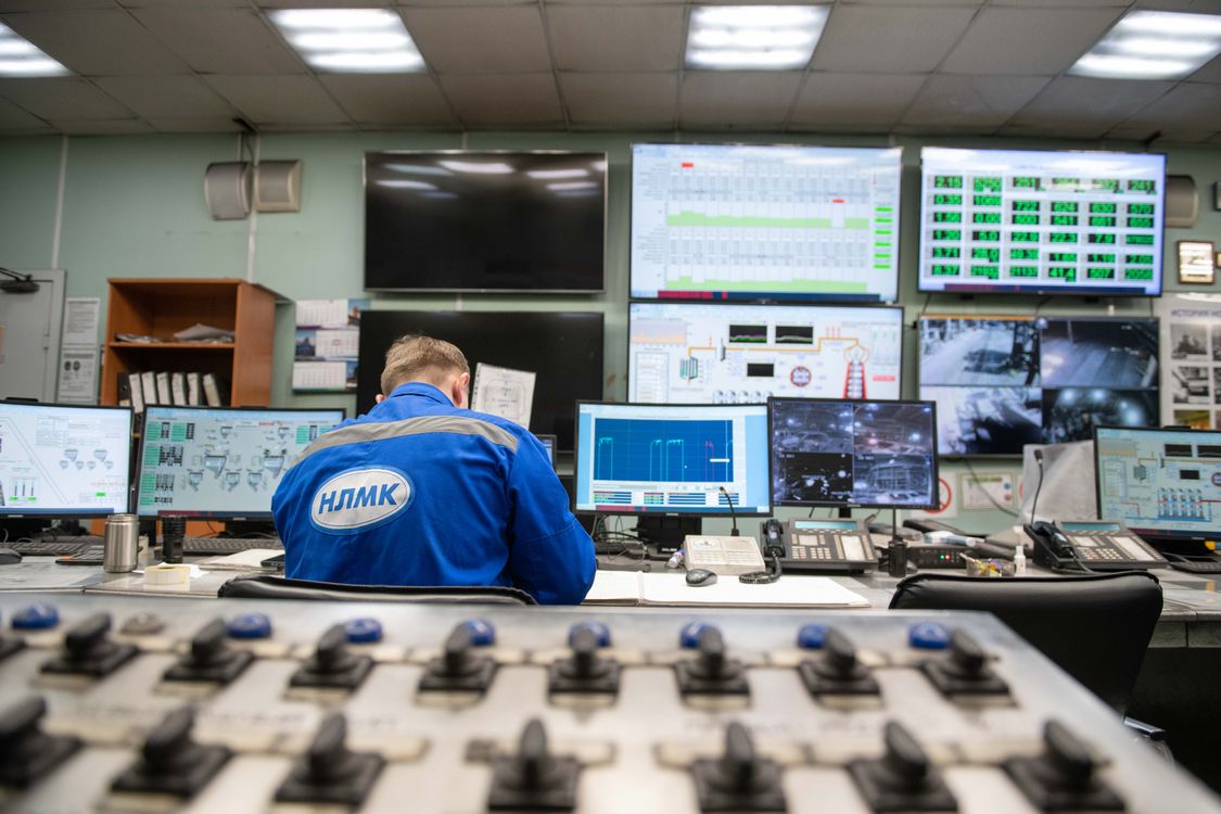 Engineer monitoring multiple screens in a control room, a metaphor for human-in-the-loop AI agent UX