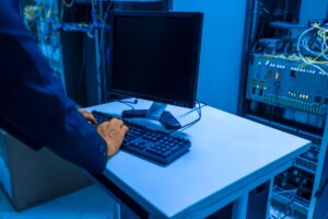 IT technician managing systems in a data center, illustrating RBAC UX and access management